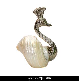 Image of peacock sculpture with shells as part of its body. isolated on white background. Home decoration Stock Photo