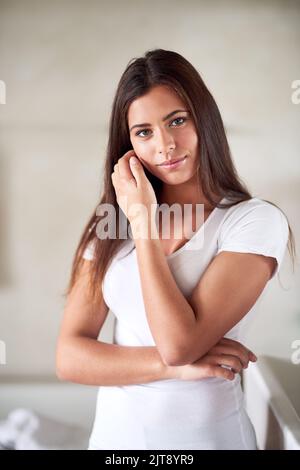 Comfortable in my own skin. Portrait of a beautiful young woman enjoying her perfect skin at home. Stock Photo