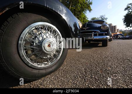 Beirut, Lebanon. 27th Aug, 2022. Classic cars are seen at an exhibition in Aley, Mount Lebanon Governorate, Lebanon, on Aug. 27, 2022. Over 65 classic car owners on Saturday gathered in Aley, a city in Mount Lebanon, showcasing their vehicles at an exhibition, where vintage collections from 1945 to 1978 parked in the city square drew the attention of many passers-by.TO GO WITH 'Feature: Lebanon's classic car enthusiasts deck out gems of collections' Credit: Bilal Jawich/Xinhua/Alamy Live News Stock Photo