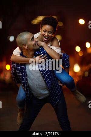 You enjoying the ride. an affectionate young couple out on a date in the city. Stock Photo
