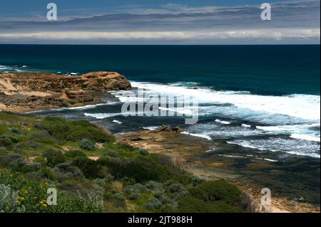 Bass Strait is famous for gales and storms - but it does produce great surf, between the rocks, at Point Nepean, in Victoria, Australia. Stock Photo