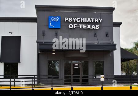 Houston, Texas USA 12-05-2021: Psychiatry of Texas building exterior and main entrance in Houston, TX. Treatment center for mental health disorders. Stock Photo