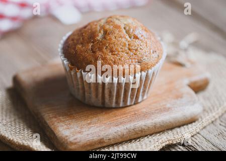 Banana Cake on wooden background, delicious sweet dessert cupcakes food or snack Stock Photo
