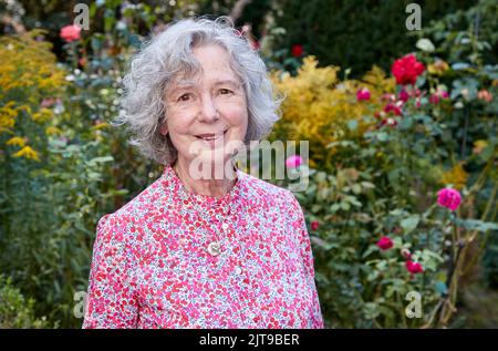 Hamburg, Germany. 24th Aug, 2022. Ulla Hahn, writer, stands in her garden after an interview about her new novel, Days in Vitopia. Credit: Georg Wendt/dpa/Alamy Live News Stock Photo