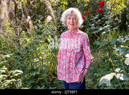 Hamburg, Germany. 24th Aug, 2022. Ulla Hahn, writer, stands in her garden after an interview about her new novel 'Days in Vitopia'. The book will be published by Penguin in Munich on Aug. 31, 2022. (to dpa-Korr 'Ulla Hahn's new eco-novel with Morus, Marx and squirrels') Credit: Georg Wendt/dpa/Alamy Live News Stock Photo