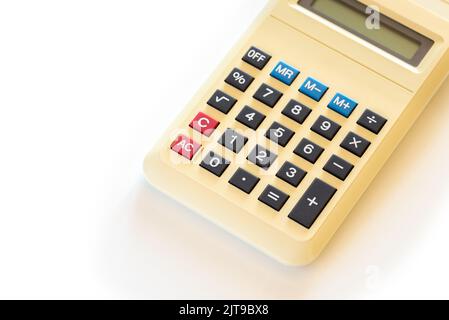 Old home calculator isolated on white backghround Stock Photo
