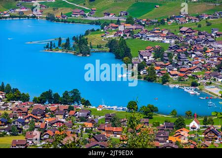 The famous Chalrutirank viewpoint overlooking Lungern, a municipality and place in the Swiss canton of Obwalden. Lungern is located on Lake Lungern an Stock Photo