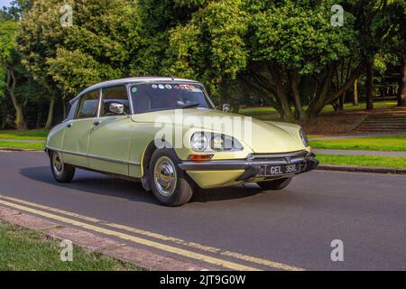 1972 70s seventies yellow French CITROEN DS 1985cc petrol saloon ; arriving at the annual Stanley Park Classic Car Show in the Italian Gardens. Stanley Park classics yesteryear Motor Show is hosted By Blackpool Vintage Vehicle Preservation Group, UK. Stock Photo