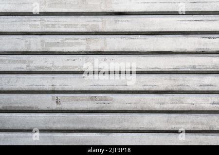 Closeup of garage steel wall texture, horizontal lines pattern, gray vintage striped door, background. Stock Photo