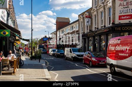 View of the North End Road in West London, a busy shopping street with market stalls Stock Photo