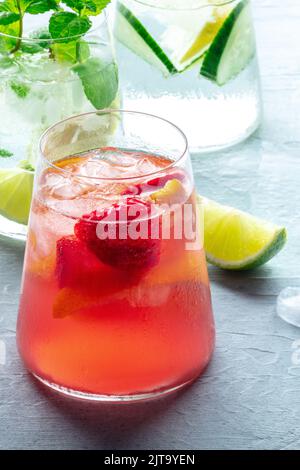 Summer cocktail. Cold drinks with fresh fruit. Healthy mocktail. Citrus and strawberry lemonades with ice Stock Photo