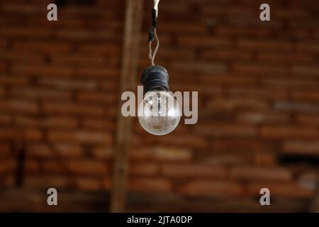old lamp wired in socket at home old house Stock Photo