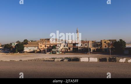 Luxor, Egypt - November 13, 2020: Local Egyptian Buildings and Sightseeing places near the main Road Stock Photo