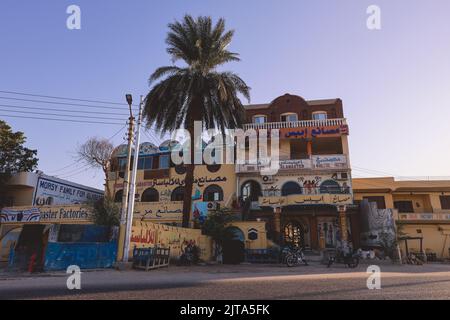 Luxor, Egypt - November 13, 2020: Local Egyptian Buildings and Sightseeing places near the main Road Stock Photo