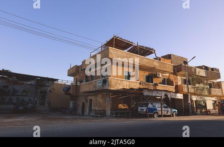 Luxor, Egypt - November 13, 2020: Local Egyptian Buildings and Sightseeing places near the main Road Stock Photo