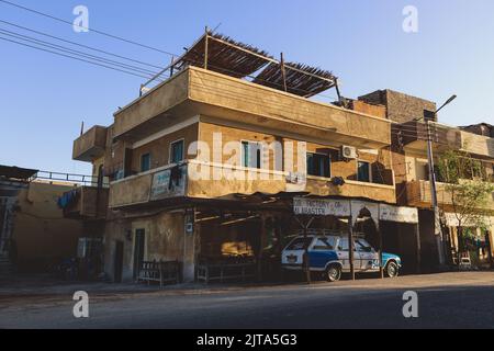 Luxor, Egypt - November 13, 2020: Local Egyptian Buildings and Sightseeing places near the main Road Stock Photo