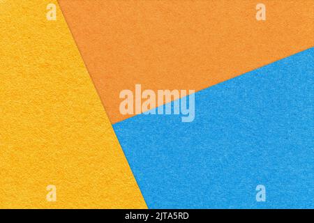 Texture of craft yellow, blue and orange shade color paper background, macro. Structure of vintage abstract cardboard with geometric shape and gradien Stock Photo