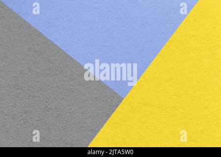 Texture of craft gray, yellow and blue shade color paper background, macro. Structure of vintage abstract cardboard with geometric shape and gradient. Stock Photo