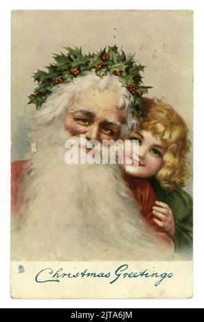 Original Edwardian Christmas greetings postcard, Santa with holly crown and small child, 'Christmas Greetings', Victorian Christmas card cards. dated and posted 20 Dec 1904, U.K. published. Stock Photo