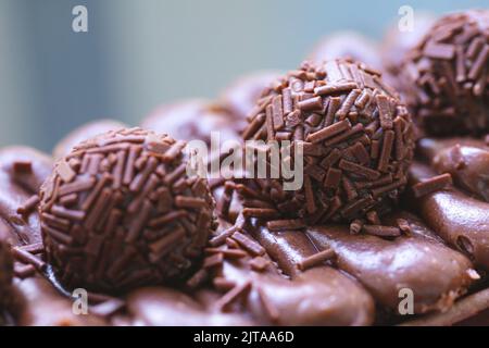 Cake called Brigadeiro Caseirinho. Chocolate cake with chocolate frosting and brigadiers to decorate. Confectionery, dessert. Stock Photo