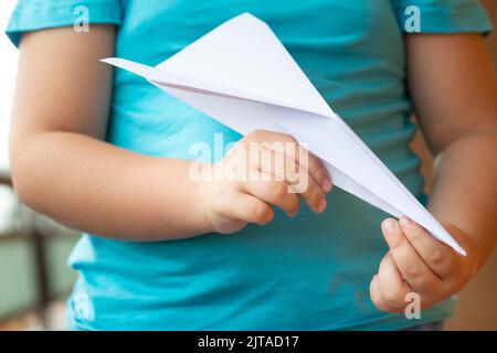 Child with Paper Plane Stock Photo