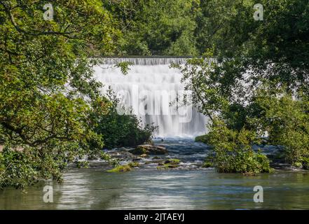 Monsal Dale weir waterfall on the River Wye in the Peak District National Park, Derbyshire, England Stock Photo