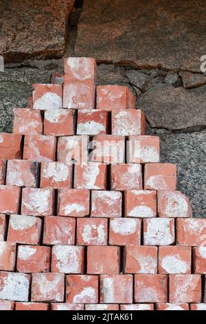 Red bricks lying on top of each other, concept of building Stock Photo