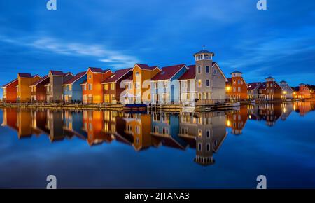 Reitdiephaven is a marina in the Dutch city of Groningen that is known for its colourful houses. Stock Photo