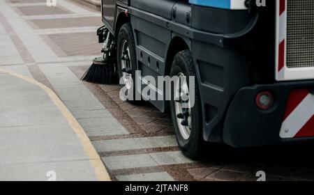 special municipal truck brushes of street cleaning machine. Street cleaning. Stock Photo