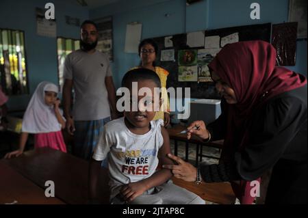 Sylhet, Mexico City, Bangladesh. 28th Aug, 2022. 28 August 2022, Sylhet, Bangladesh: A child from Kanishail Primany school receives a Comirnaty dose during a vaccination program to children against increase infection of Covid-19 disease. (Credit Image: © Md Rafayat Haque Khan/eyepix via ZUMA Press Wire) Stock Photo