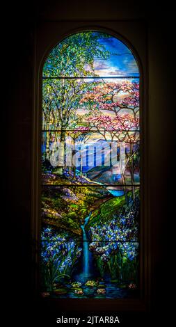 Albany, NY USA - July 6, 2016: Interior view of Louis Comfort Tiffany stained-glass window with waterfall scene. Stock Photo