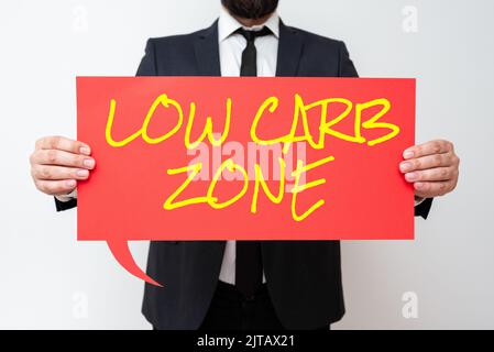 Conceptual display Low Carb Zone. Business concept Healthy diet for losing weight eating more proteins sugar free Businessman Holding Speech Bubble Stock Photo