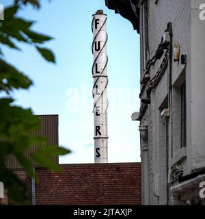 Fullers brewery sign in Chiswick, London against a blue sky. Stock Photo