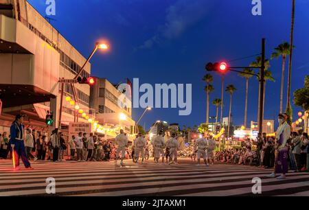 Tokushima, Japan - August 12, 2022: Crowd watches drum group on street at Awaodori Matsuri Stock Photo