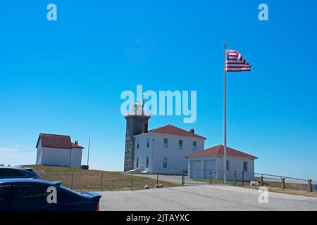 Watch Hill lighthouse in Westerly, Rhode Island on a clear day with a bright blue sky -06 Stock Photo