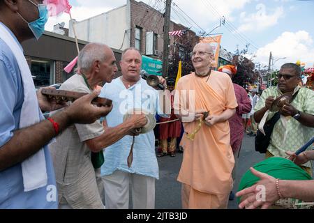 At the start of the Queens Ratha Yatra Parade, Hindu men play hand cymbals, drums & a kartal. On Liberty Avenue in Richmond Hill, Queens, New York Stock Photo