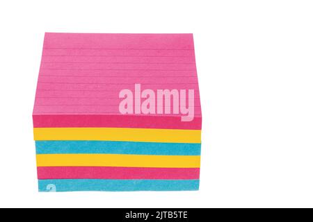 Close up of multi-colored  lined paper isolated on white background. Stock Photo