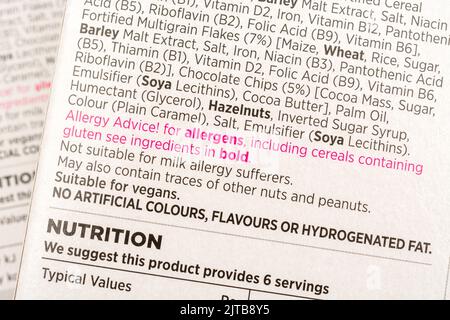 Shot of ASDA own-label chocolate & nut breakfast cereal bar showing ingredients labelling. Prime focus on 'allergens'. For food allergen labelling. Stock Photo