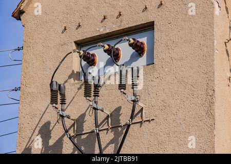 Power lines and resistances of a tower for transformation of electricity, Germany Stock Photo