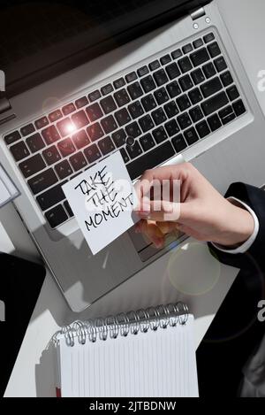 Text sign showing Take The Moment. Internet Concept Seize the day and opportunity be happy optimistic positive Hand Holding Lamp With Formal Outfit Stock Photo