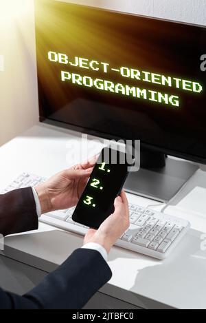 Inspiration showing sign Object Oriented Programming. Business approach Language model objects rather than actions Businessman With A Pad Showing A Stock Photo