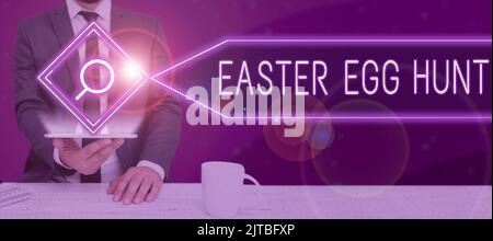 Text sign showing Easter Egg Hunt, Internet Concept Searching special season treats presents spring tradition New Ideas On Pieces Of Paper On Desk Wit Stock Photo
