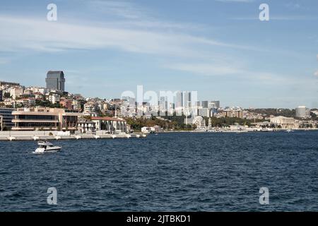 View of a yacht on Bosphorus and European side of Istanbul. It is a sunny summer day. Stock Photo