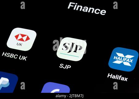 SJP app seen on smartphone screen between other banking apps as HSBC UK, Halifax. St. James's Place (SJP) is an Expert Financial Advice company. Staff Stock Photo