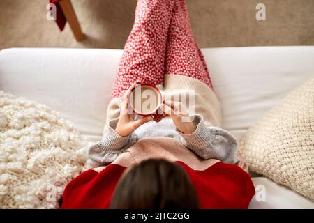woman rinking coffee at home on christmas Stock Photo