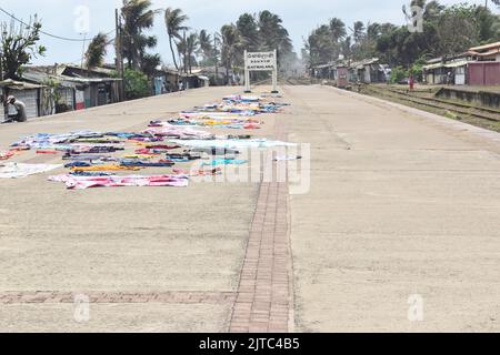 People living on the beach in shanty's dry cloths on the platform at a railway station in Colombo. The Railway Network was introduced by the British in 1864 and 1st train ran on 27th December 1864, with the construction of the Main Line from Colombo to Ambepussa, 54 kilometers to the east. The Sri Lankan rail network is 1,508 km (937 mi) of 5 ft 6 in (1,676 mm) broad gauge. Some of its routes are scenic, with the main line passing (or crossing) waterfalls, mountains, tea estates, pine forests, bridges and peak stations. Sri Lanka. Stock Photo