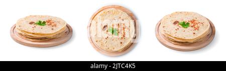 A set of chapati cakes in different angles isolated on a white background. Stock Photo