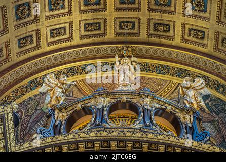 London, England, UK - July 6, 2022: St. Paul's Cathedral. Detail featuring golden statues of angels adoring preaching saint on bow supporting choir ce Stock Photo