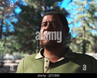 A middle aged, confident expression, African American man stands in the sunlight in the woods outside. The man was created using 3D computer graphics. Stock Photo