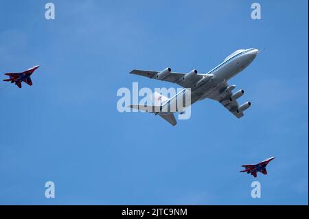 MOSCOW, RUSSIA - MAY 7, 2022: Avia parade in Moscow. MiG-29 and strategic bomber and missile platform IL-86 in the sky on parade of Victory in World W Stock Photo